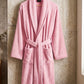 White TORK cotton bathrobe with shawl collar, soft and comfortable, shown hanging on a hook.