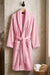 White TORK cotton bathrobe with shawl collar, soft and comfortable, shown hanging on a hook.
