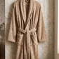 White cotton Turkish bath towel by TORK, showing soft texture and traditional design, perfect for comfortable, luxurious use.