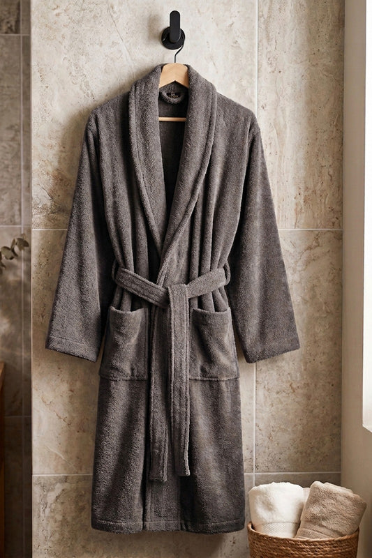 Soft white cotton Turkish bathrobe from TORK, shown hanging with a plush texture and cozy design.