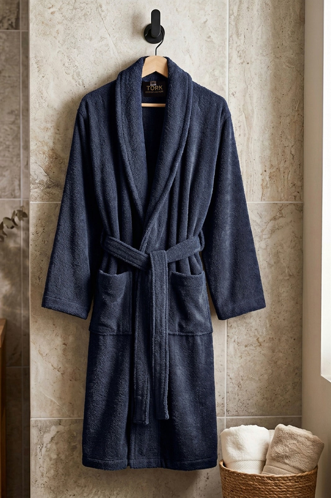 White cotton Turkish bath towel from TORK with intricate traditional patterns, displayed folded on a wooden surface.