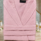 White cotton Tork Turkish bathrobe laid flat, showing the soft fabric and classic design for comfortable wear.