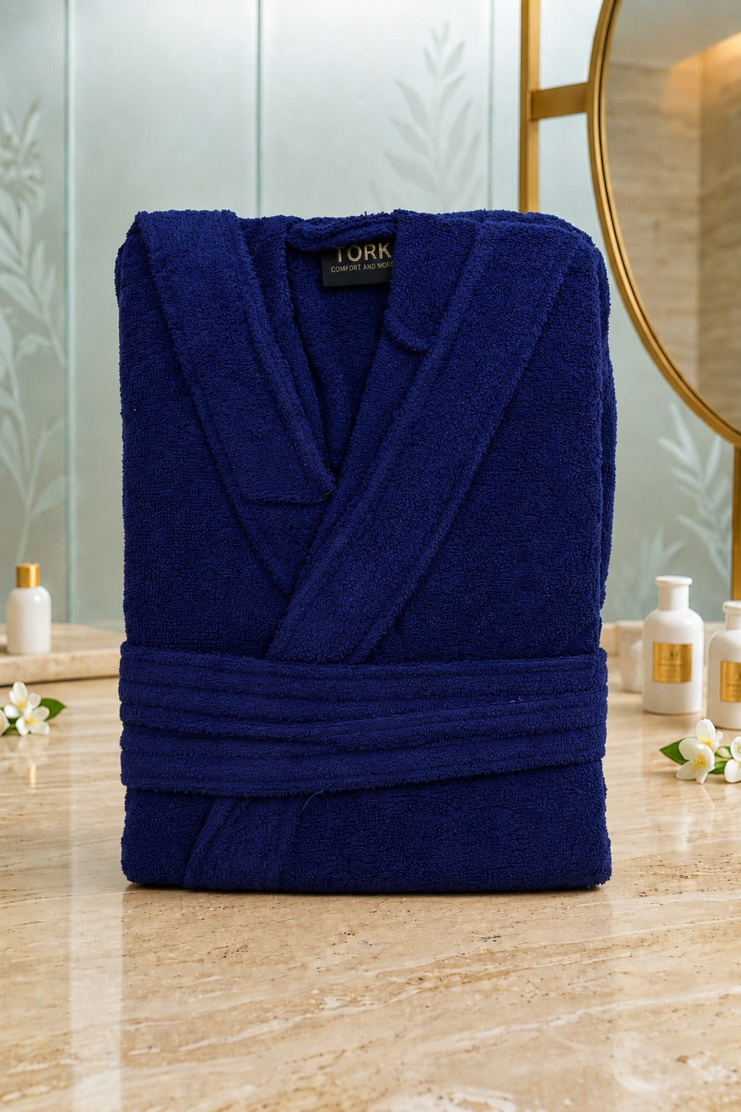 White cotton Turkish towel from TORK with intricate traditional patterns, displayed folded on a neutral background.