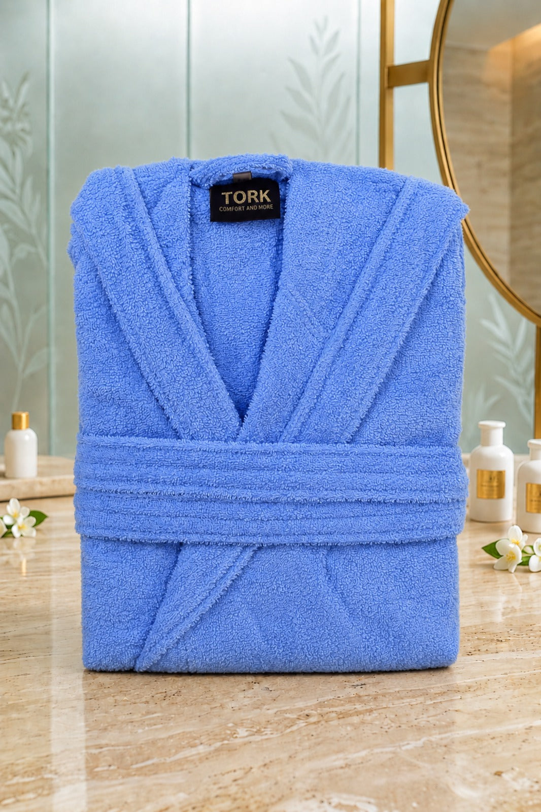 Soft white cotton Turkish bath towel by TORK, shown folded with textured fabric and fringed edges.